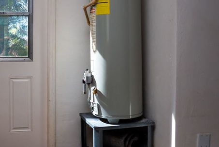 water heater in a garage corner